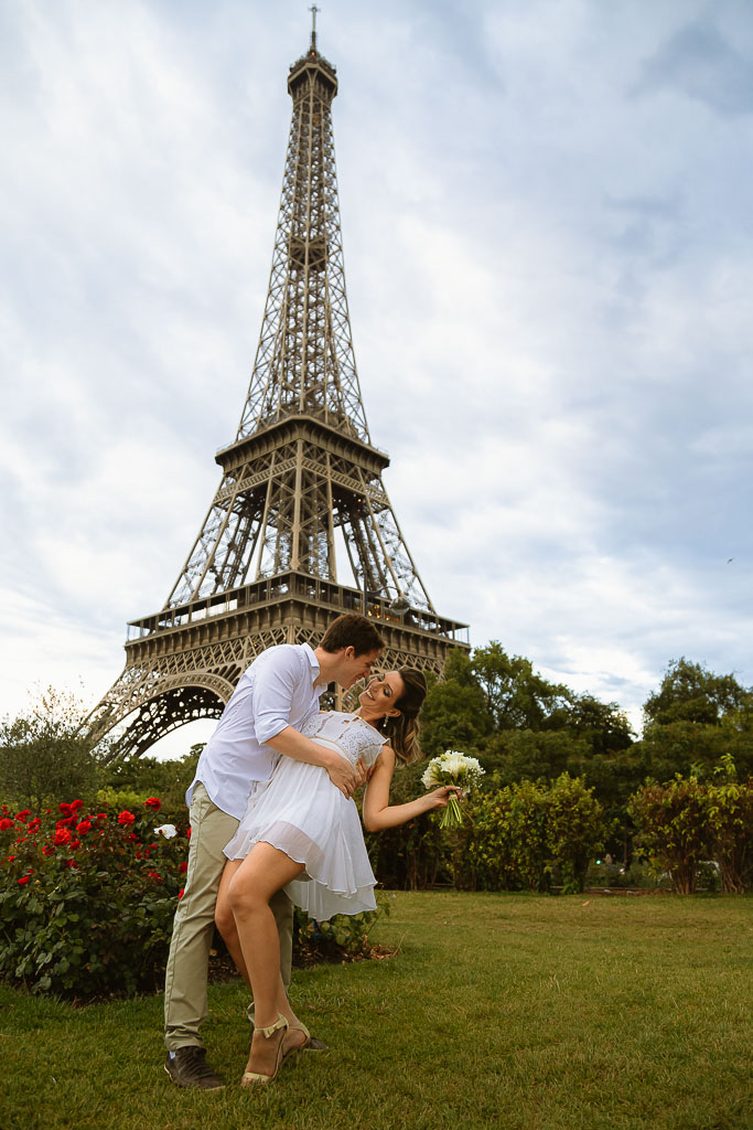 Couple happy smiling in front of Eiffel Tower