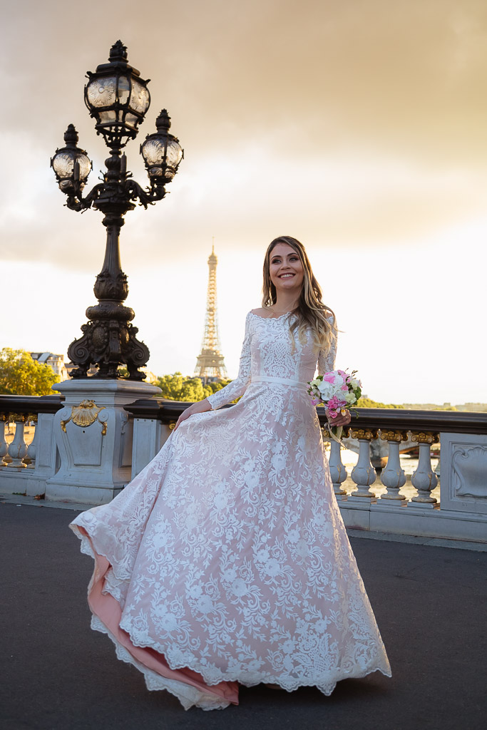 Elopement Wedding photographer - Happy bride during sunset at Alexandre III Bridge in Paris