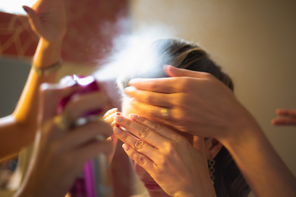 Hands helping bride to fix hair for Elopement wedding in Paris